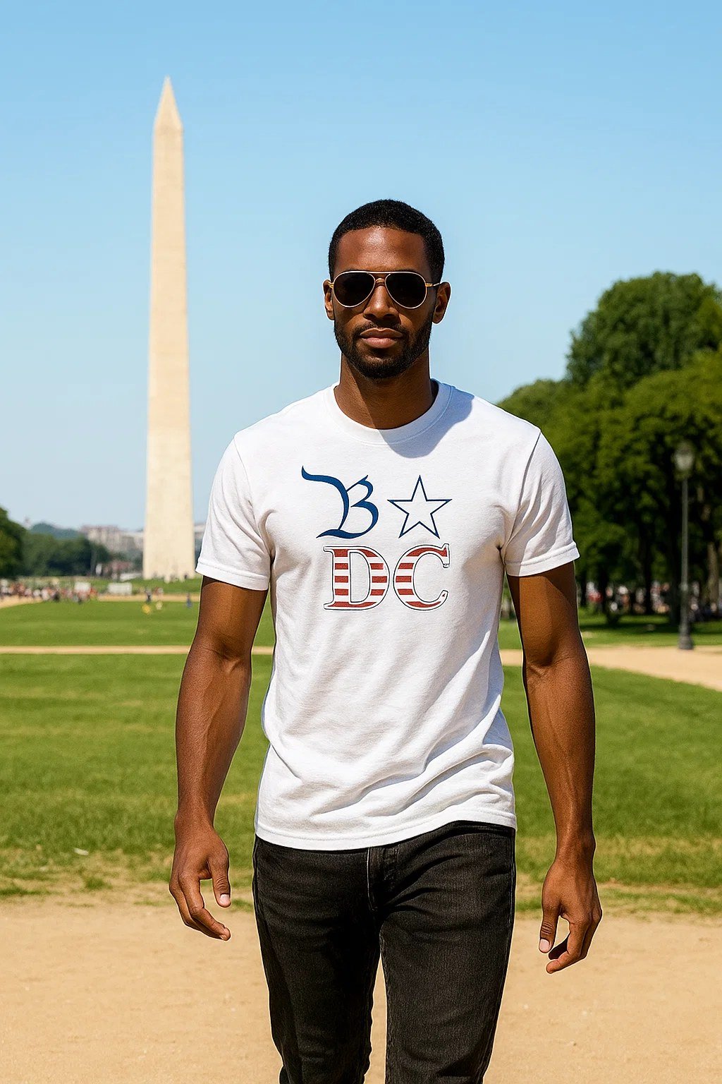 Man wearing a white B★DC t-shirt on the National Mall, Washington Monument behind him